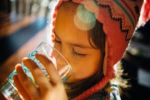 Child drinking a glass of water